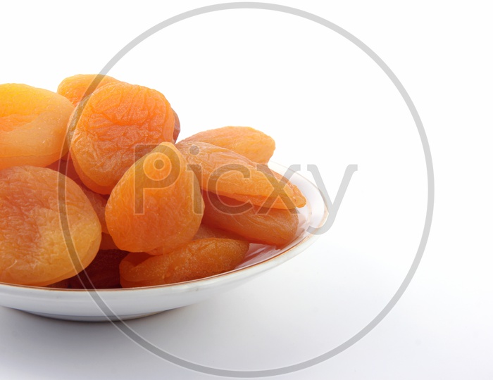 Dried Apricots  in a Bowl on a Isolated White Background
