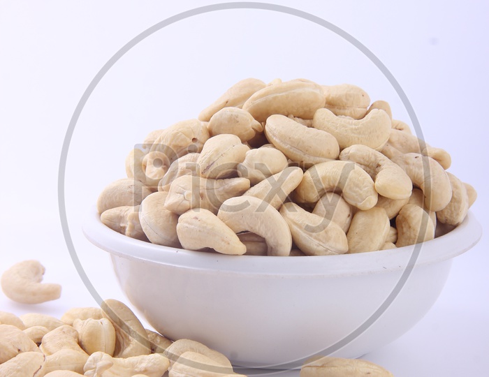 Bowl of Cashews / Cashews  in a Bowl isolated on a White Background