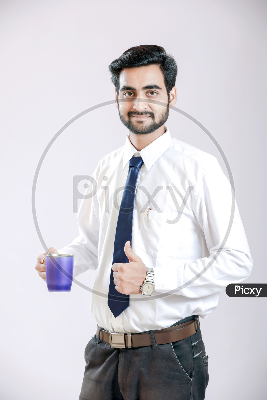 Young Indian Man Holding Cup in Hand