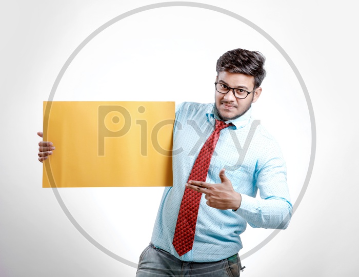 Indian  Model in Formalwear Showing Empty  Placard with Expression on an Isolated White Background