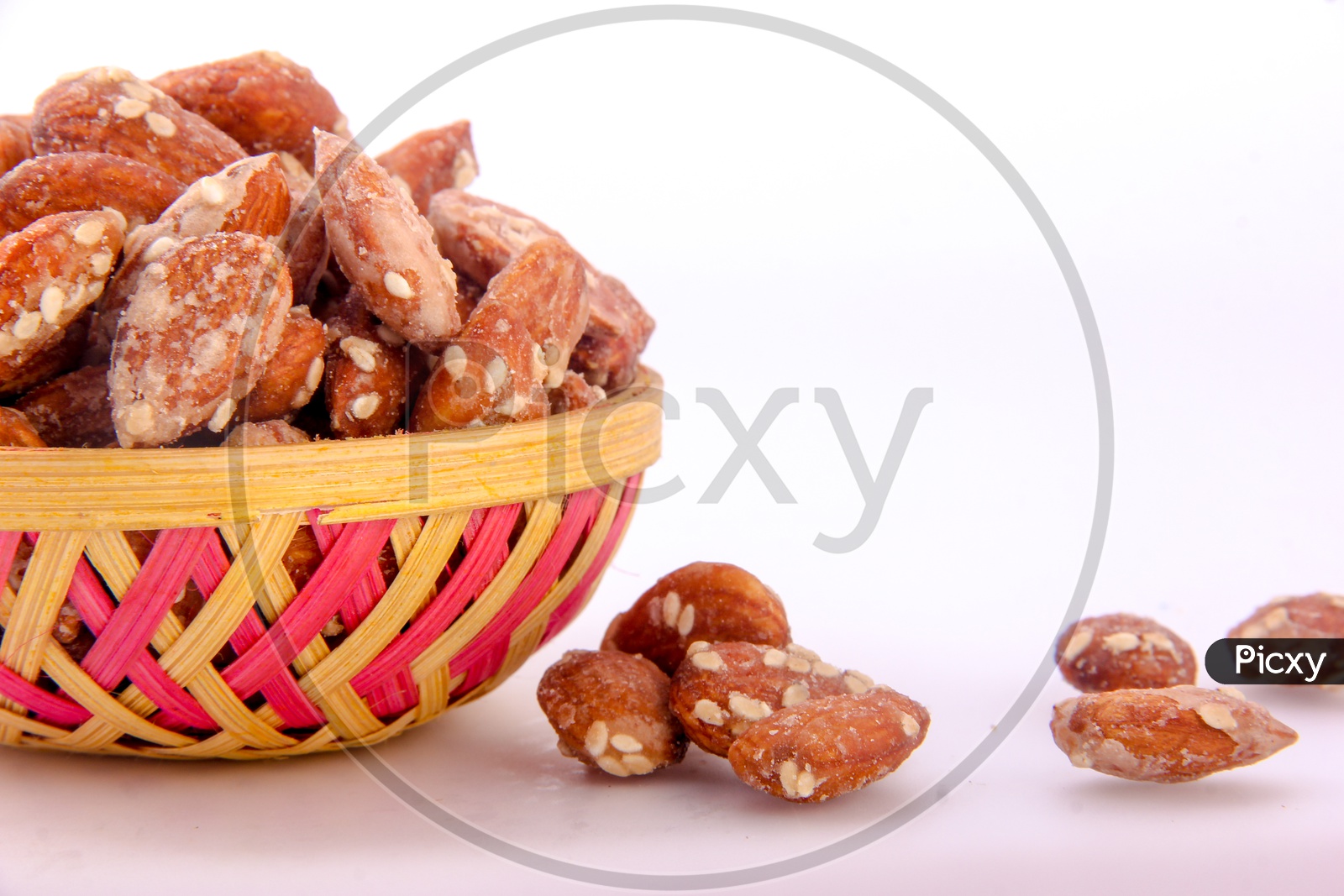 Sugar Sesame Almonds  in Bowl Isolated in White Background