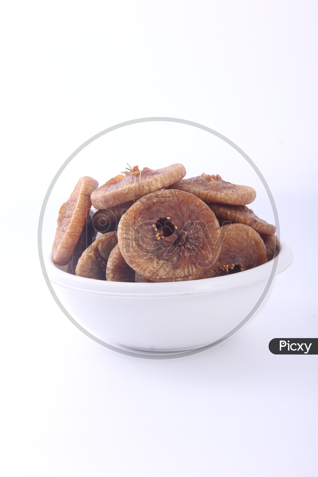 Dried Fig or Anjeera  in a Bowl on an Isolated White Background
