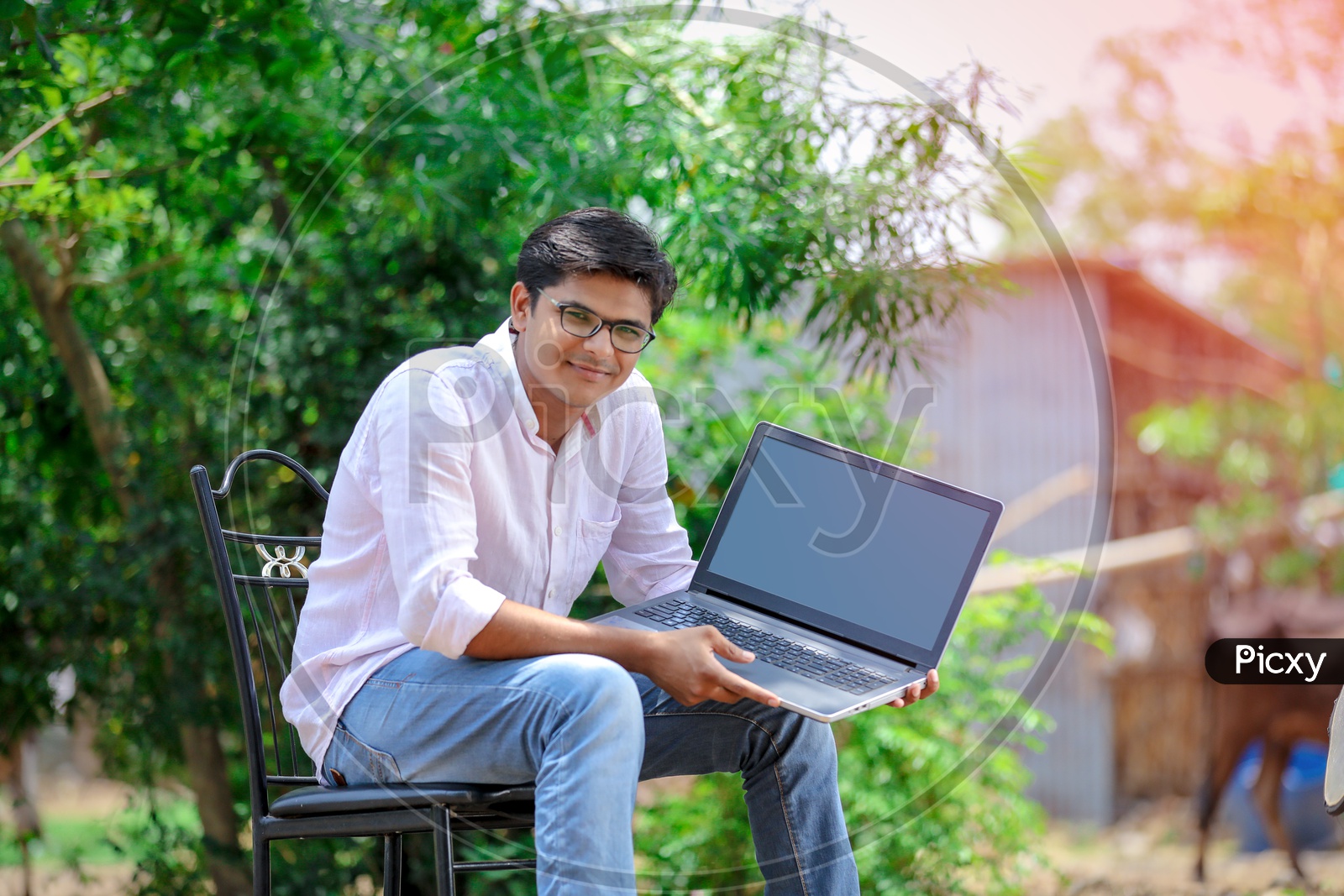 Indian College Student using Laptop with smiling face