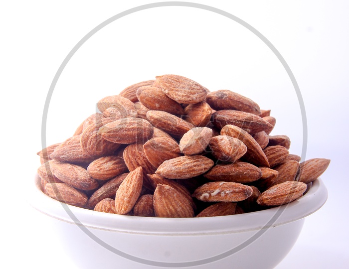 Almonds / Badam In a Bowl On an Isolated White Background