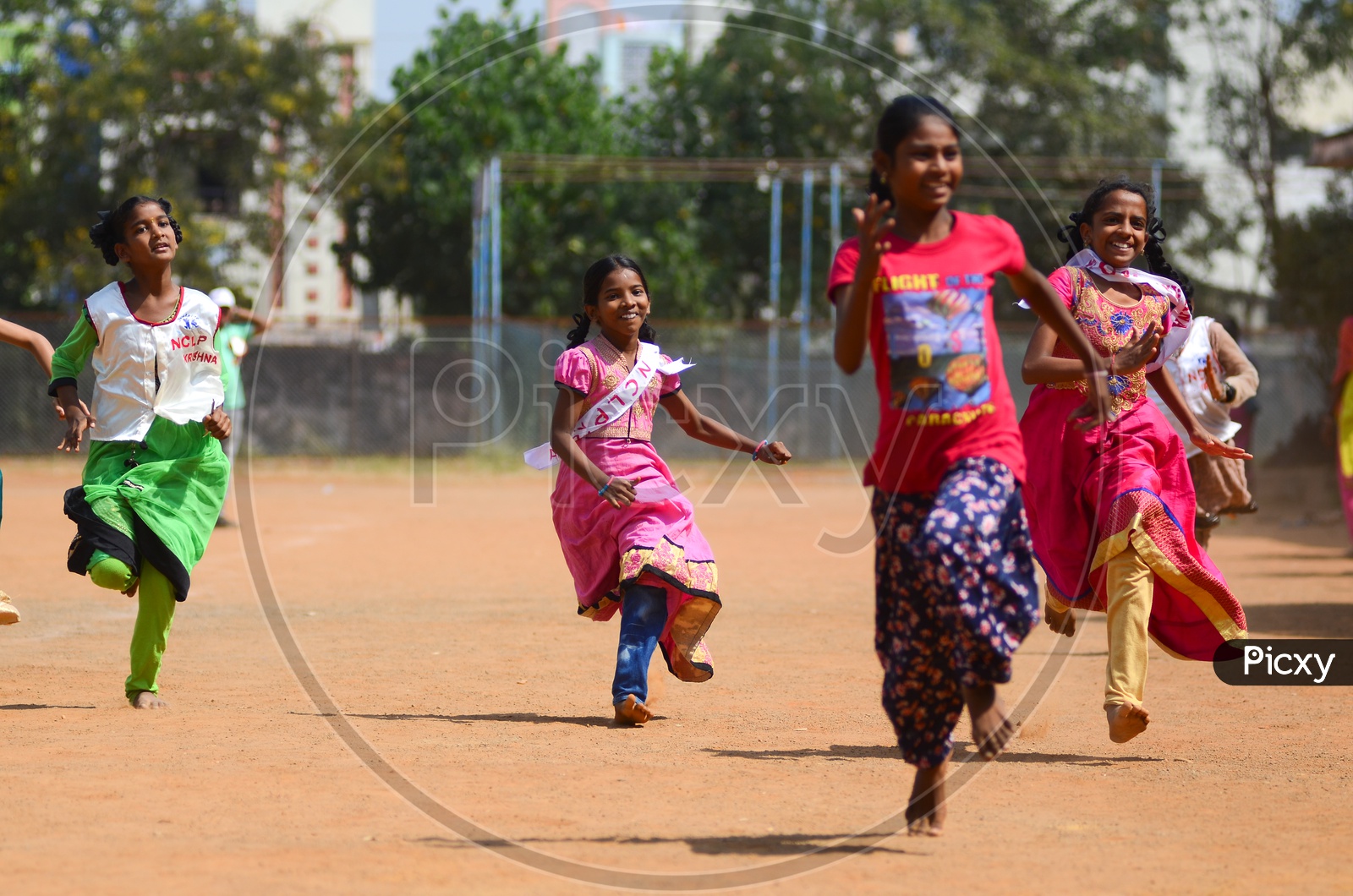 Girls participate in games conducted during National Child Labour Project program