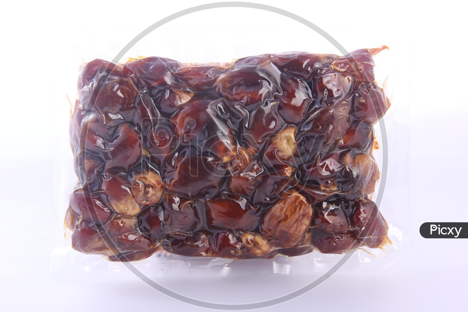 Dates Packed in a Tight Polyethylene on a White Background