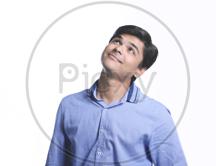 Young Indian College Student Thinking, Indian Male Model on White Background