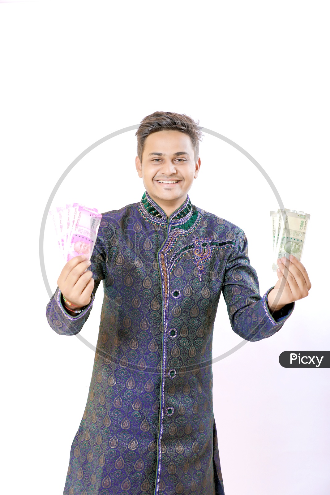 Indian Businessman Holding Money in His Hands On an isolated White background