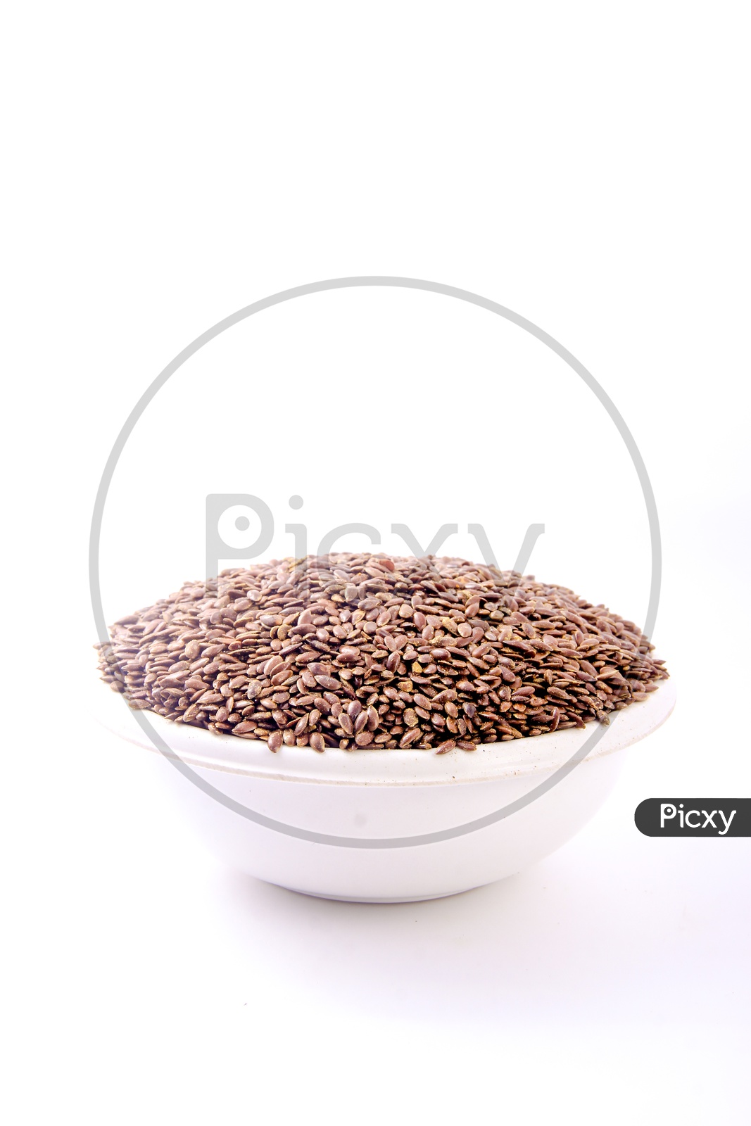 Flax Seeds in a Bowl On an Isolated White Background