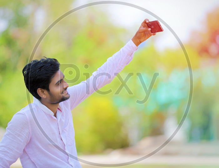 A Young indian Man Taking a Selfie
