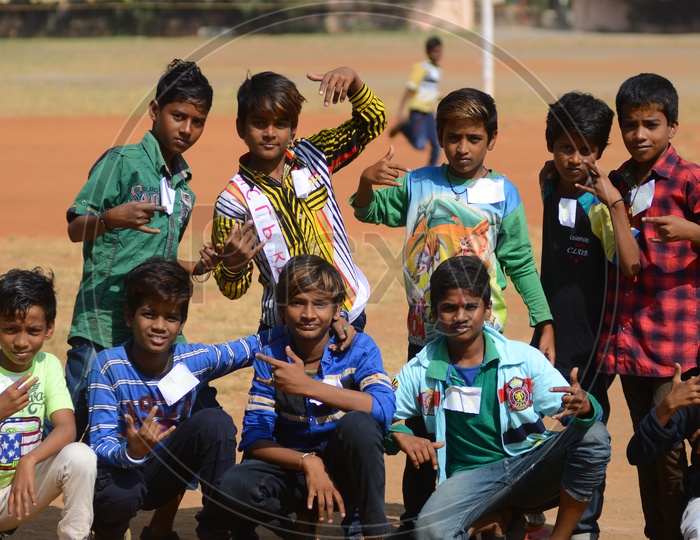 Children pose for a photograph during National Child Labour Project program.