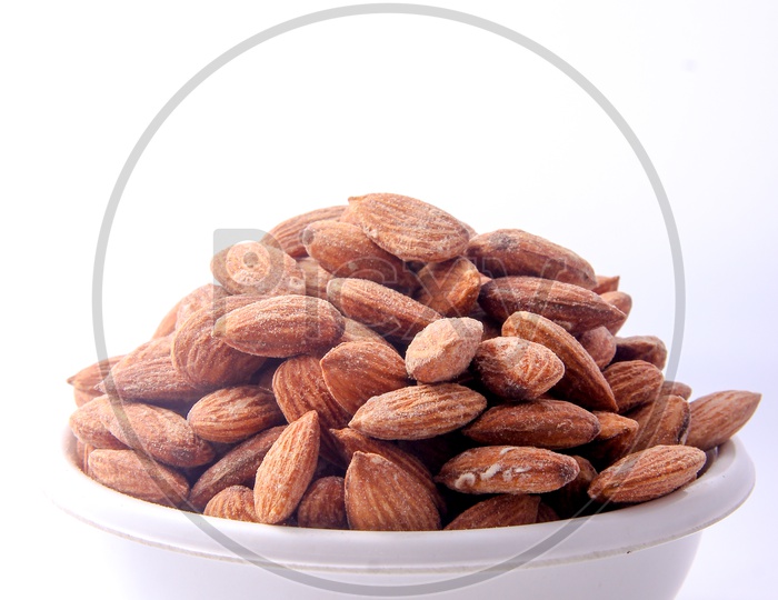 Almonds / Badam In a Bowl On an Isolated White Background