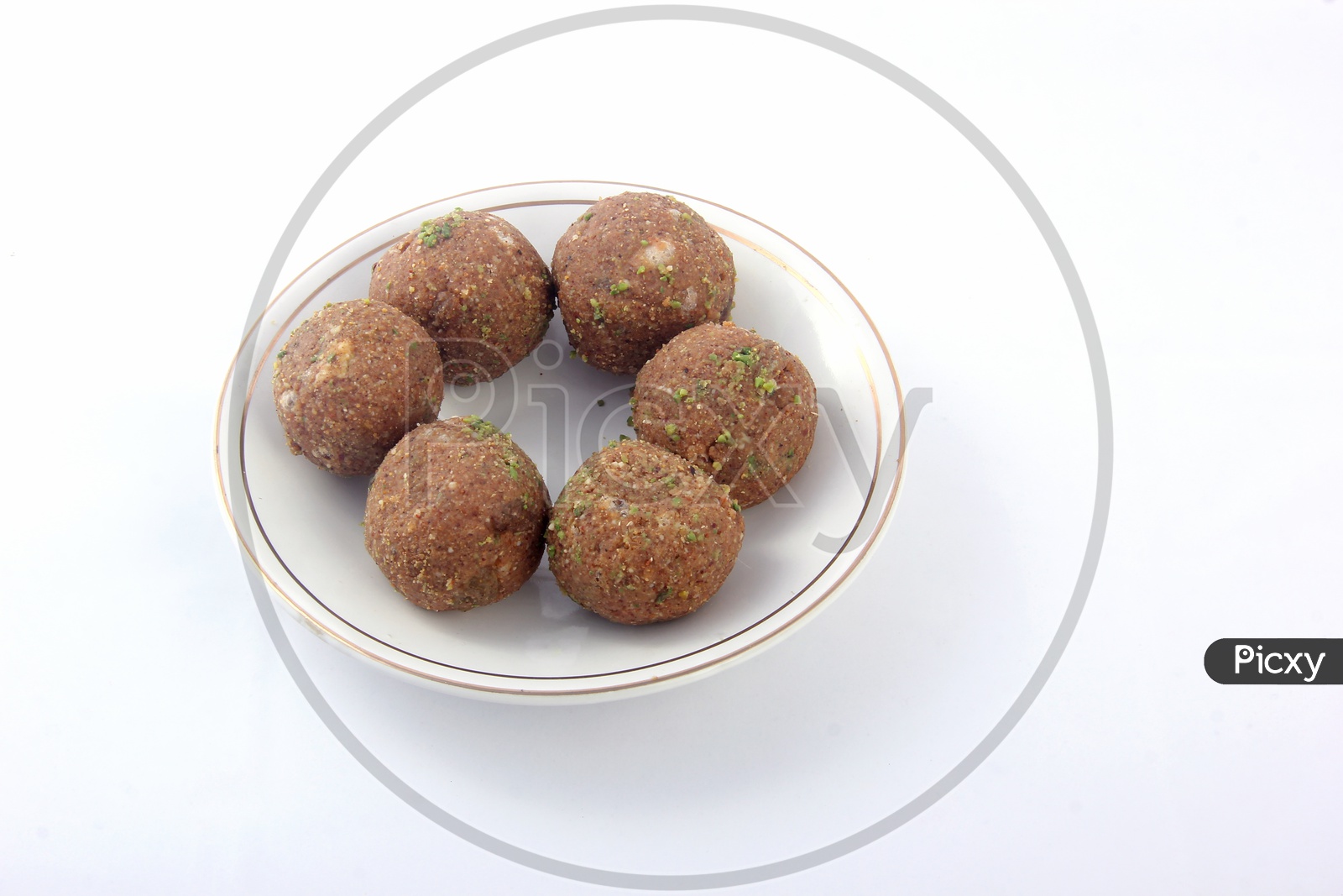 Dry Fruit Laddu in a Plate l on a Isolated White Background