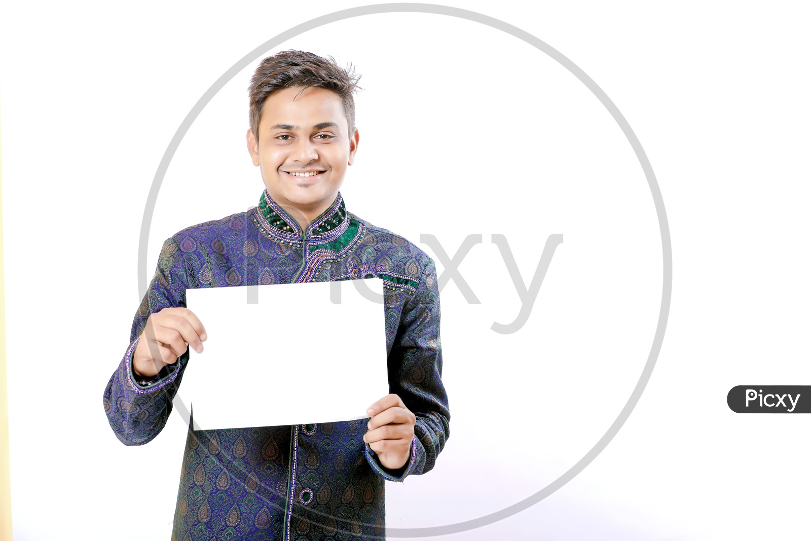 Indian Man Holding a White Placard in Hands on an Isolated White Background