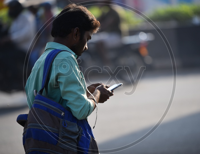 Man Using Mobile in Traffic