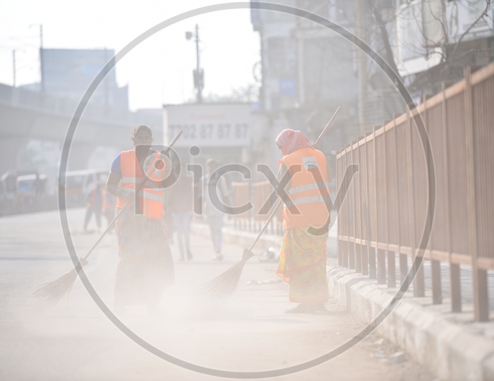 GHMC Workers Cleaning Road