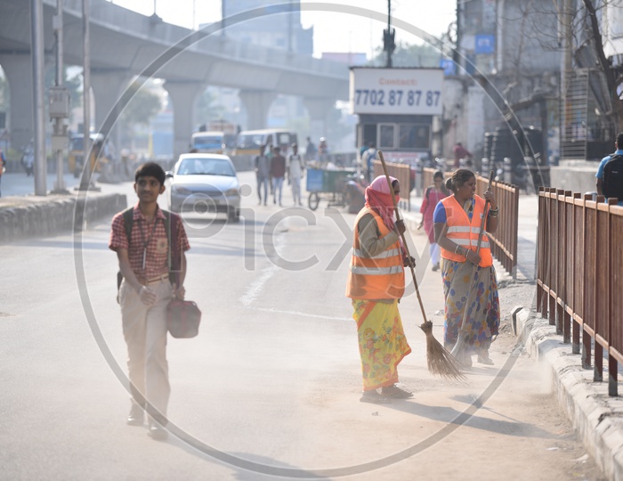 GHMC Workers Cleaning Road