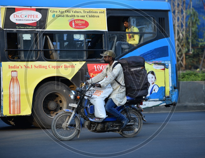 Xpressbees delivery man riding bike without wearing Helmet
