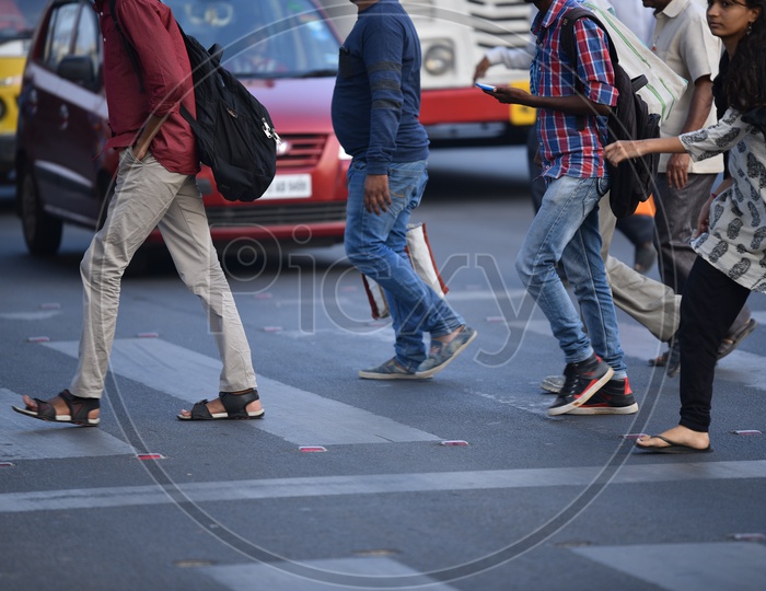 pedestrians crossing road at a Zebra Crossing in KPHB