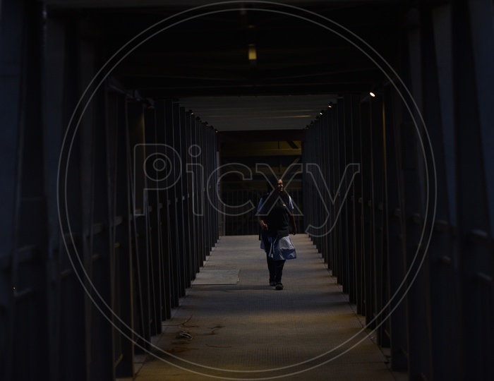 a person walks through a new foot over bridge,kphb