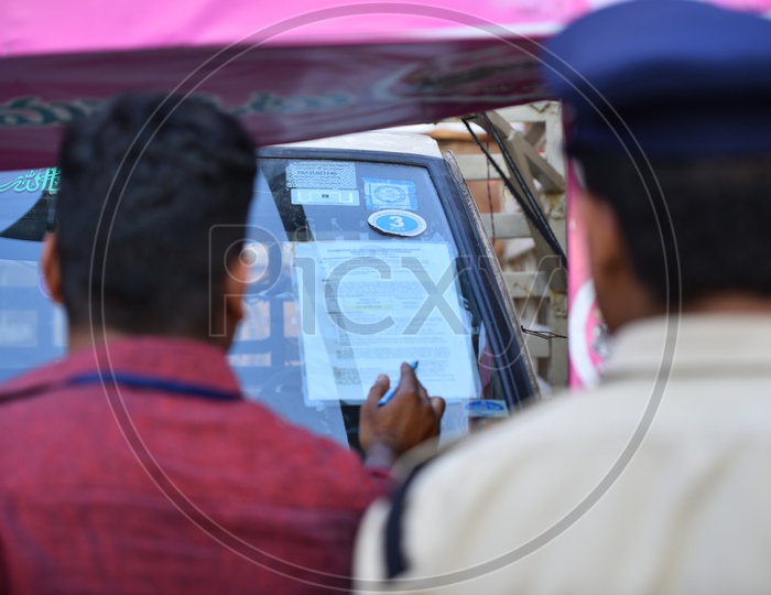Policemen check a Election Canvassing vehicle, Telangana