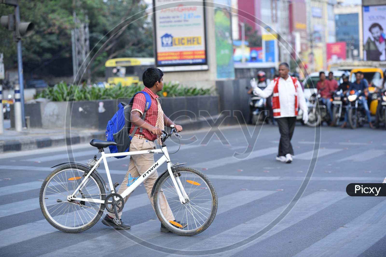 A student crosses road at a Zebra Crossing in KPHB