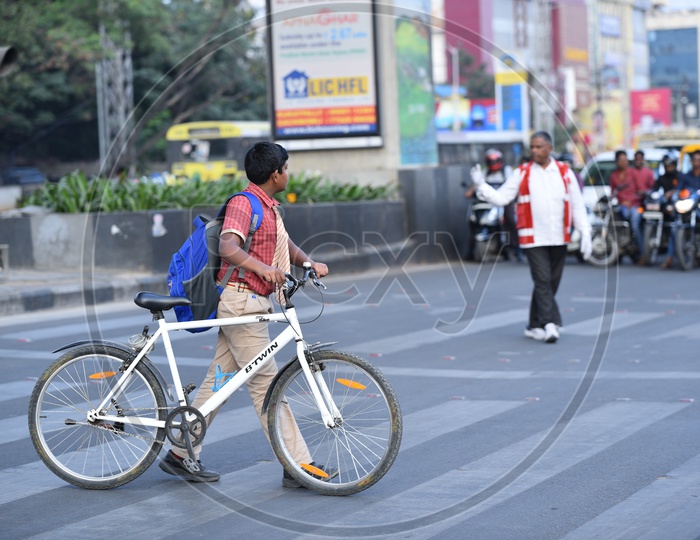 A student crosses road at a Zebra Crossing in KPHB
