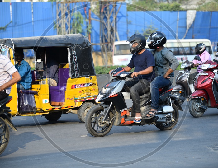 Helmets on for both Pillion Rider and the rider of a bike. Hyderabad traffic police implements the new rule for using helmets for both rider and the pillion as well.