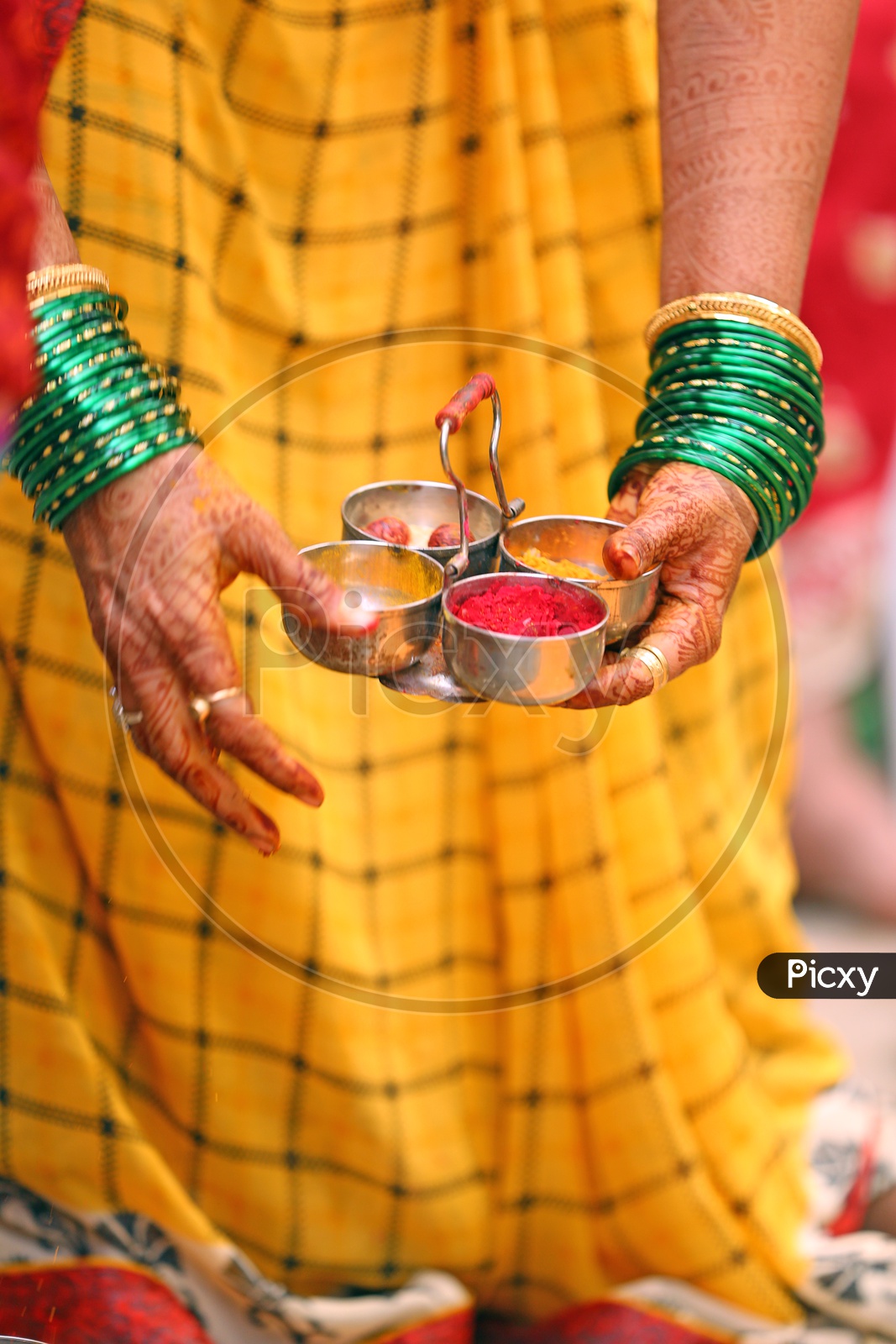 Indian Women With Turmeric and Kumkum  in a Hindu Wedding
