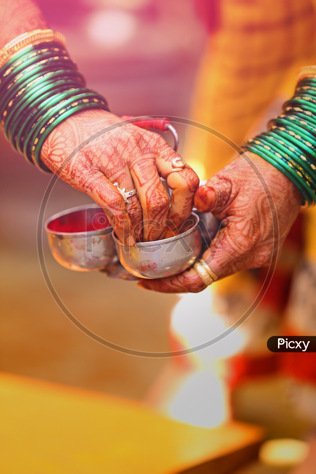 A women Hands Closeup Shot of Termeric And Kumkum in a Traditinal Hindu Wedding