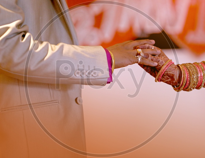 Bride Exchanging thre Wedding Ring  To Groom In  an Indian Wedding