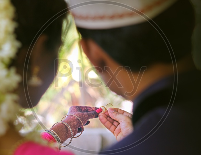 Couple With Their Wedding Rings in Indian Wedding