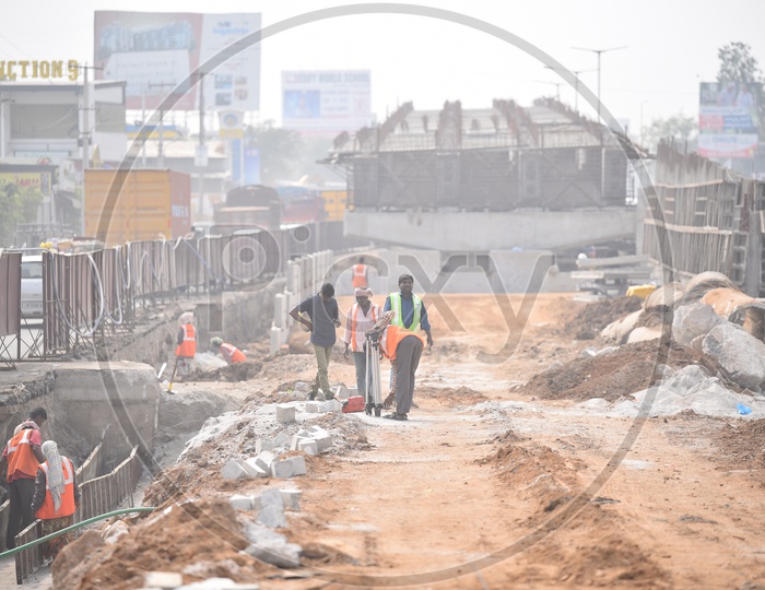 Workers carrying out their works at a underconstruction flyover.