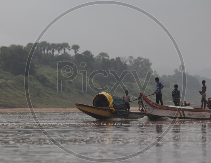 Two boats sailing on the bank of river godavari.