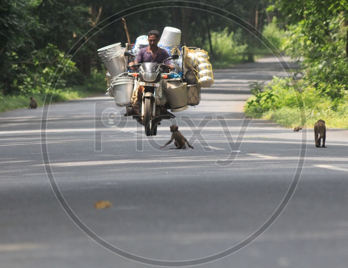 A man carrying load on his motor cycle.