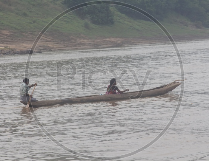 A Couple rowing a boat on river Godavari.