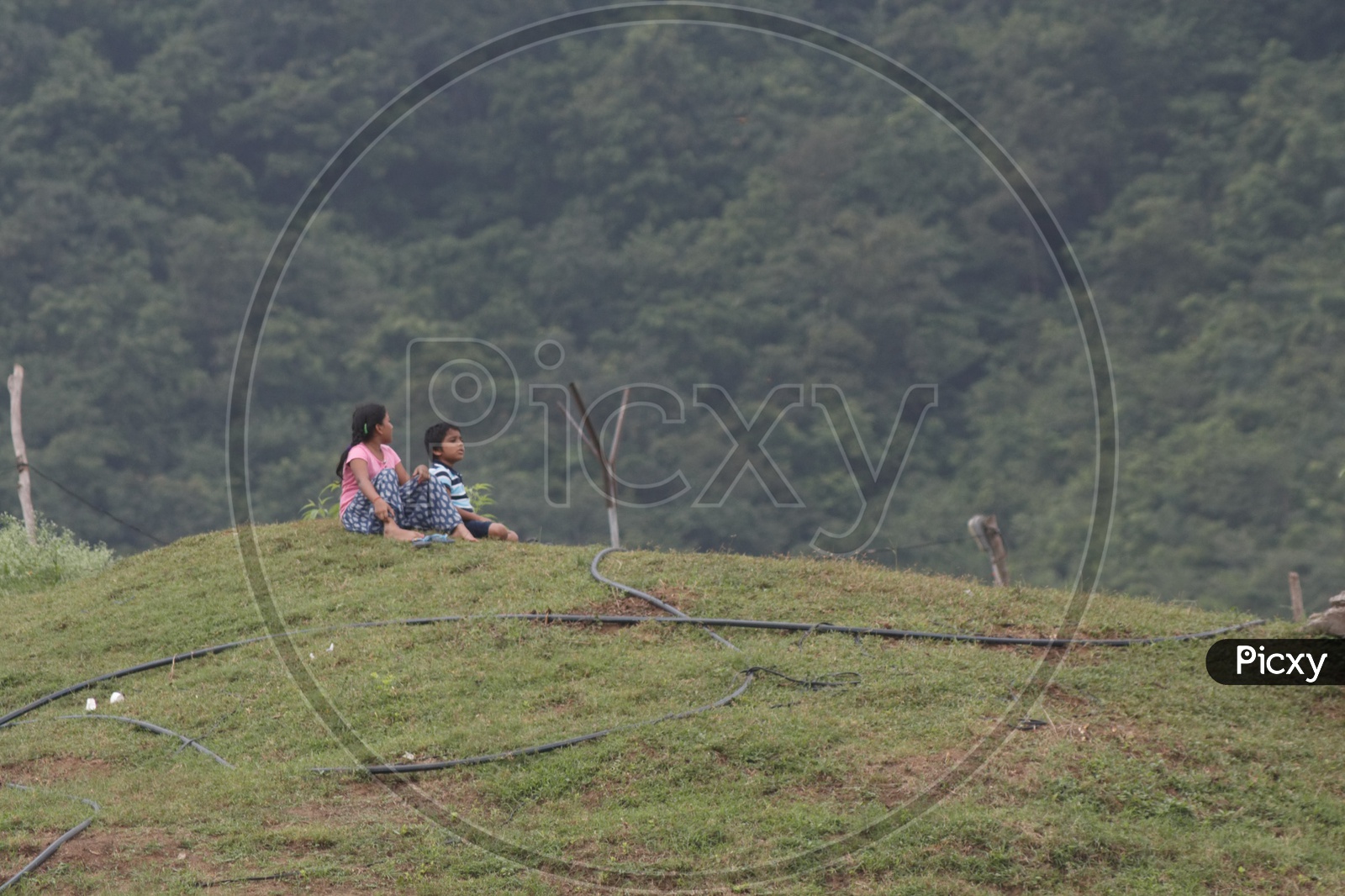 Two children enjoying the view of papi Kondalu