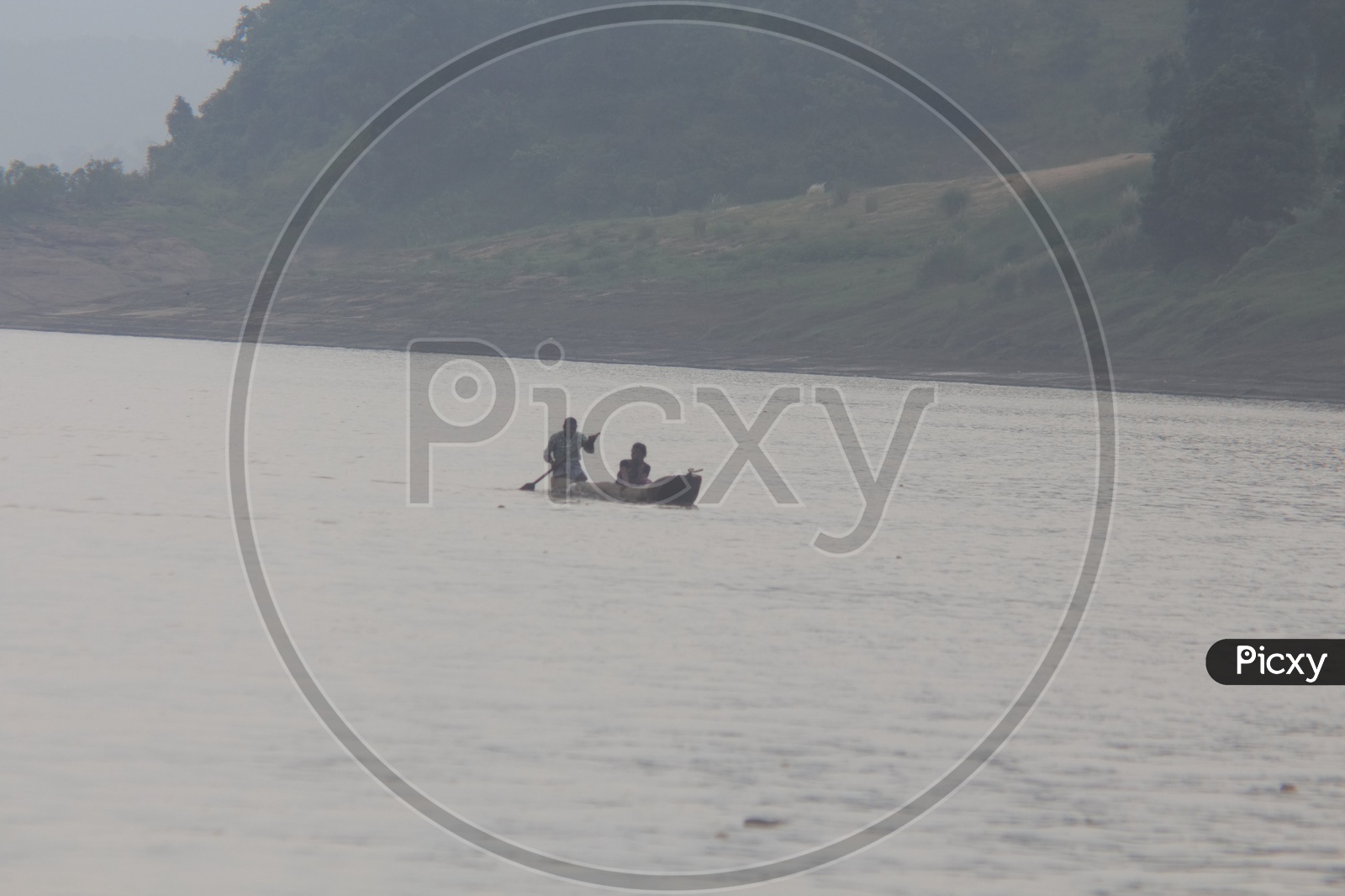 A Couple rowing a boat on river Godavari.