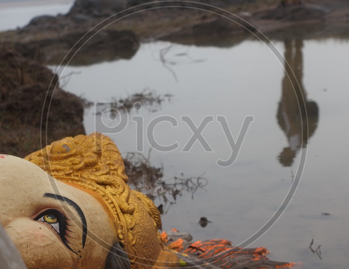Ganesh idol after the immersion on the bank of river godavari.