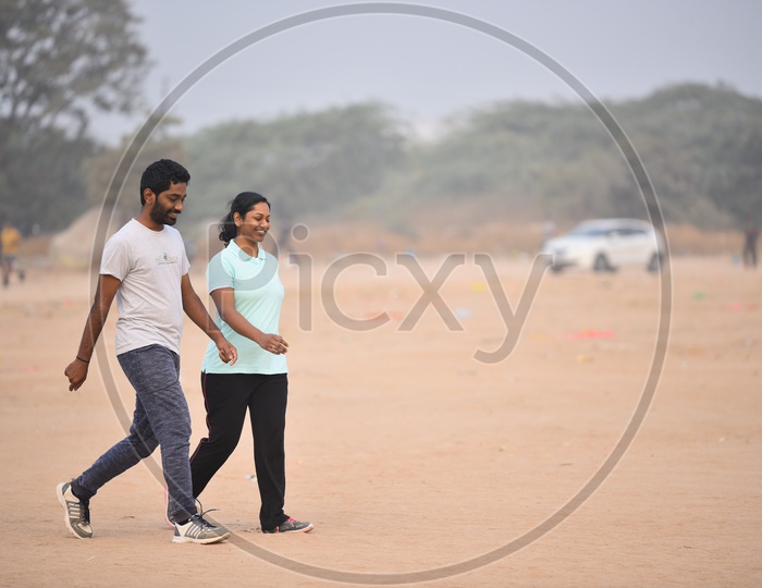 A couple walking as a part of morning exercise.