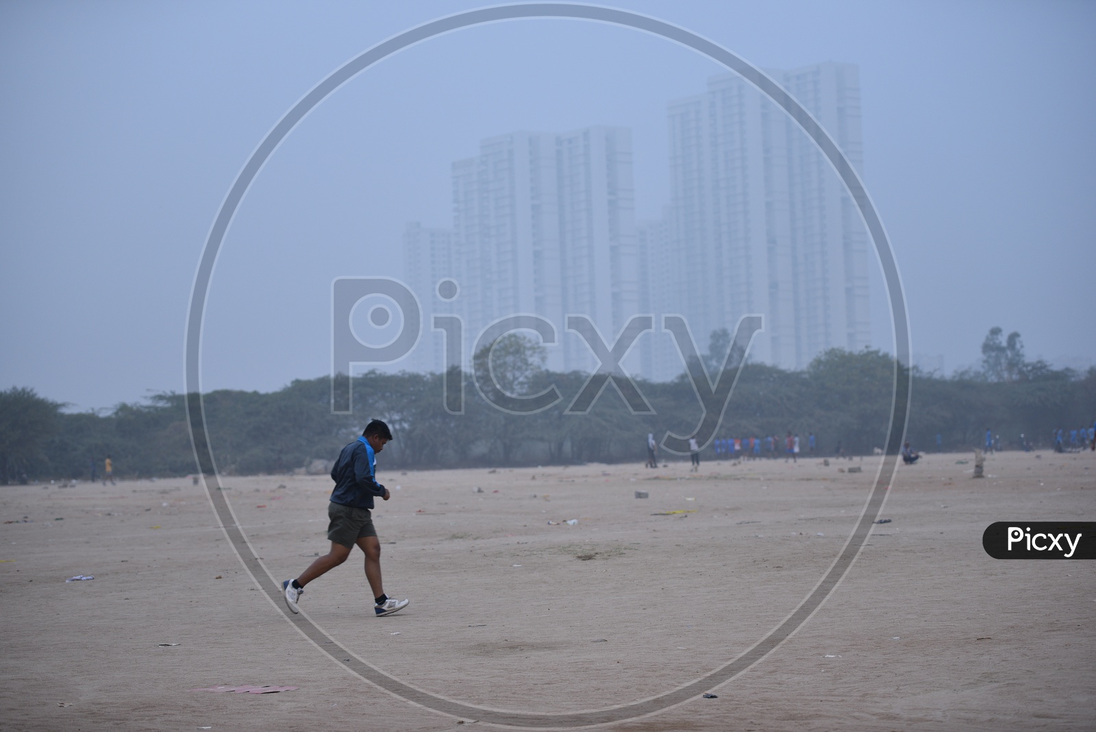 A man jogging in grounds as a part of morning exercise.