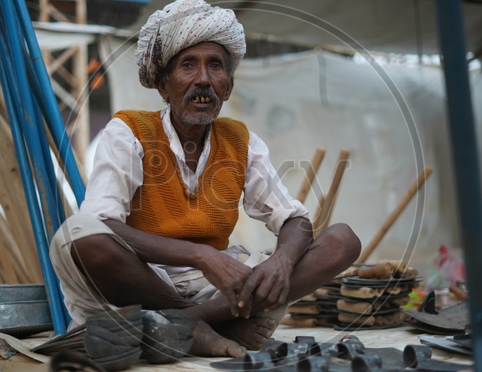 An Old Man Selling Tools Made Of Cast Iron Spotted in Pushkar Fair