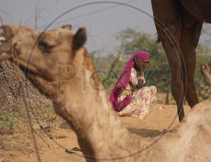 A Woman Speaking in Phone at Pushkar Camel Fair