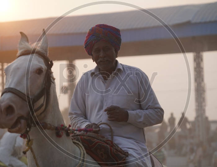 Indian Village Horse Riders in Pushkar Camel Fair Ground,Pushkar, Rajasthan, India
