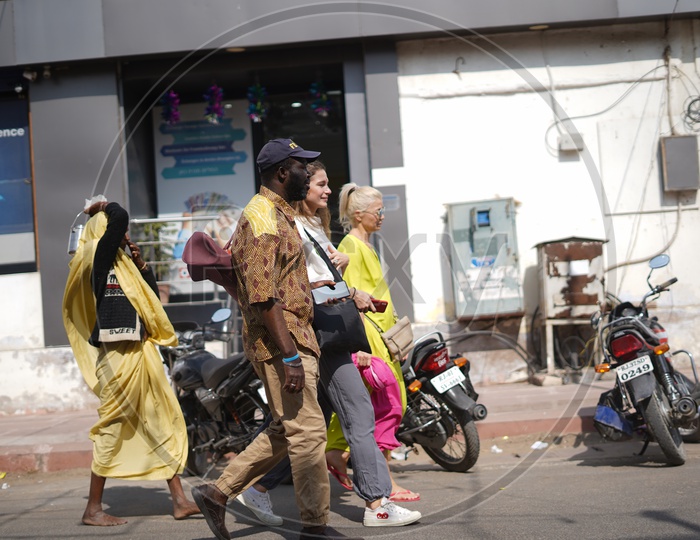 Foreigners Walking Along The Road in Pushkar Streets