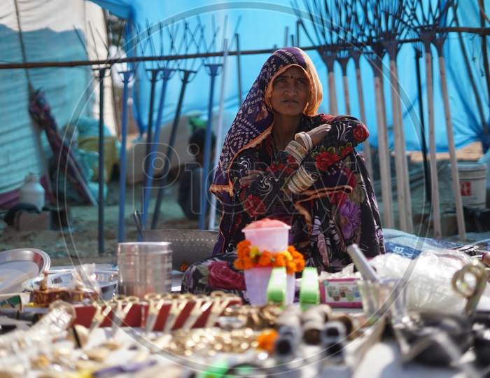 Rajasthani Woman Vendor Selling Household Things in Pushkar Fair