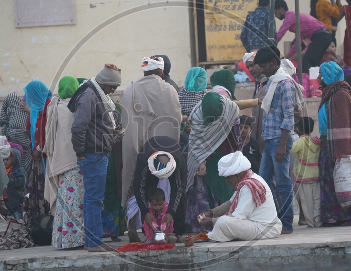 People of Pushkar participating in  pooja at Pushkar Camel Fair