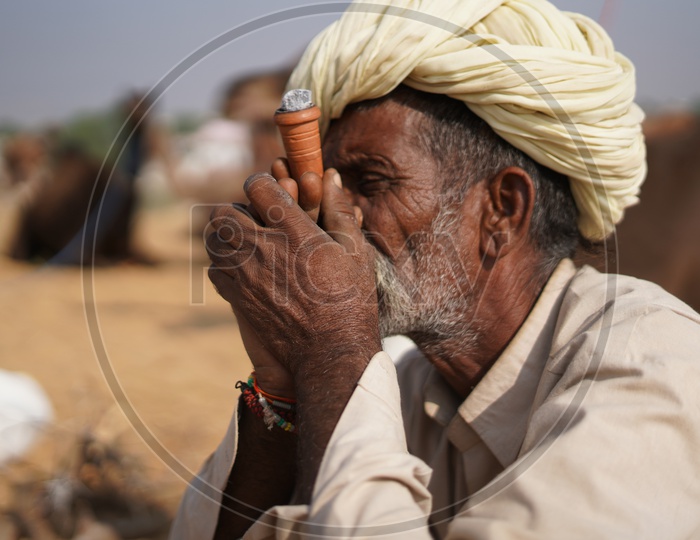 Rajasthani Man smoking at Pushkar Camel Fair, 2018