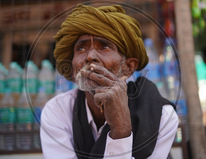 Potrait Of a old man in Pushkar Fair Smoking a Beedi