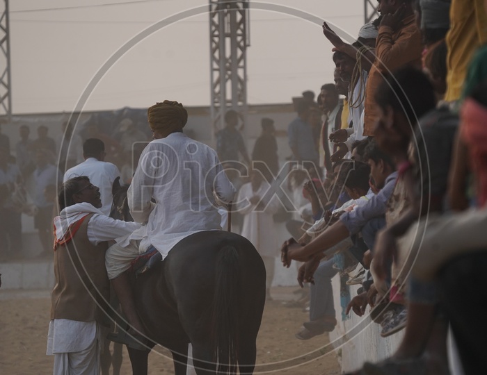 Indian Village Horse Riders at Pushkar Cattle Fair Ground,Pushkar, Rajasthan, India